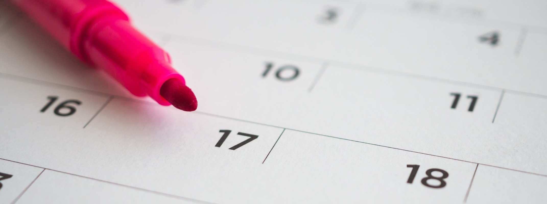 image of a pink pen on a calendar