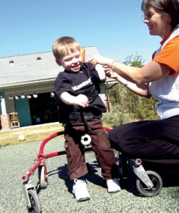 Toddler with assistive device